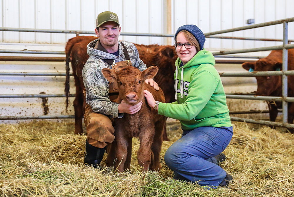 Ag Management Students with a calf
