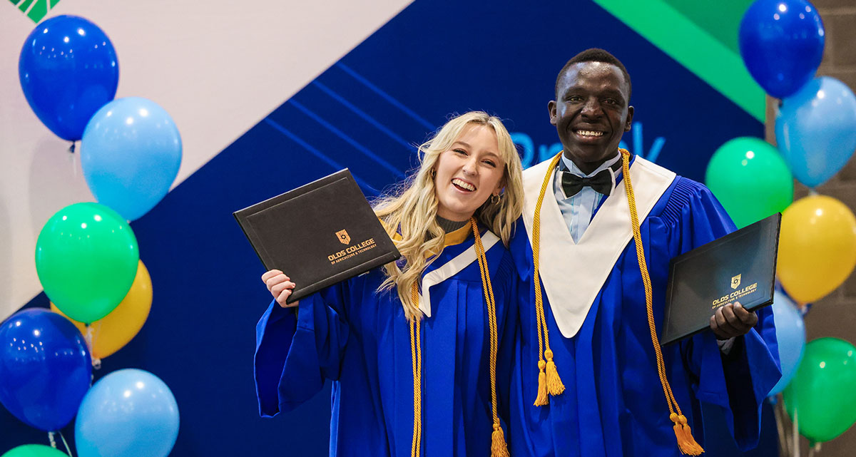 Two OC Students in their Convocation Gowns