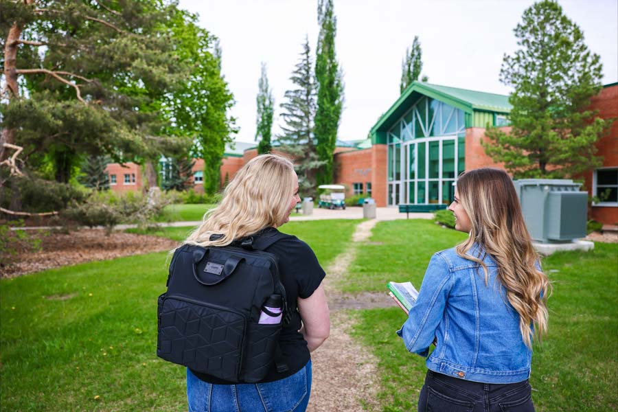 two students walking around campus